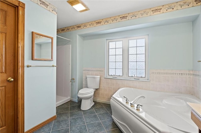 bathroom featuring toilet, tile walls, tile patterned floors, and plus walk in shower