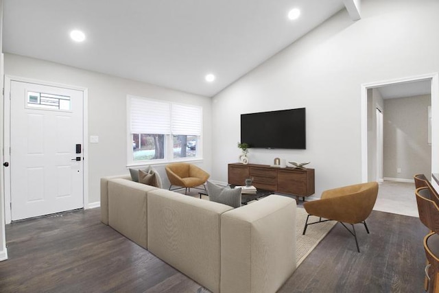 living room with dark hardwood / wood-style flooring and high vaulted ceiling