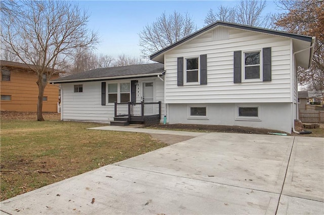 split level home featuring a front lawn