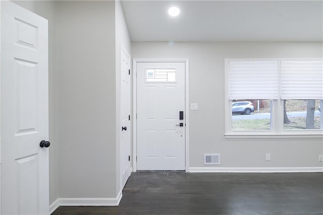 foyer entrance featuring dark hardwood / wood-style floors