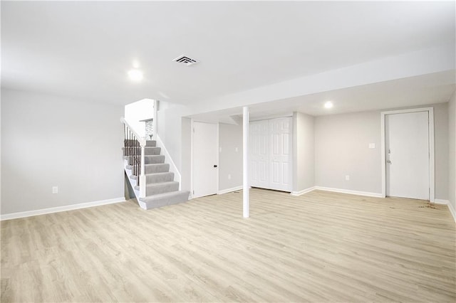 basement featuring light wood-type flooring