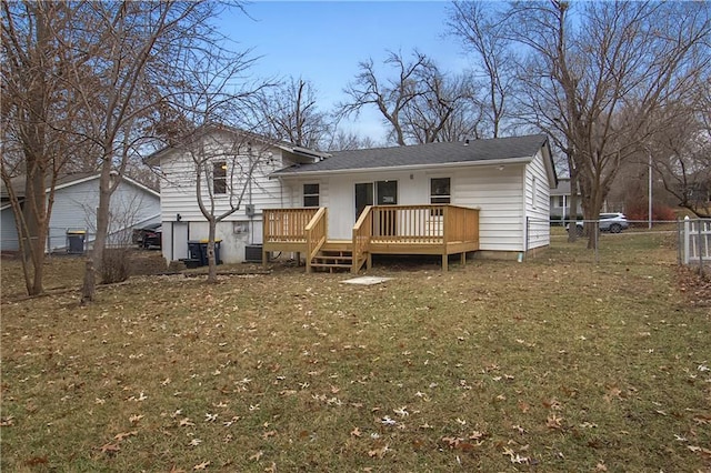 back of house featuring a yard, central AC unit, and a wooden deck