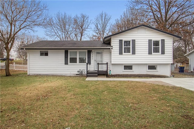 split level home with a front lawn