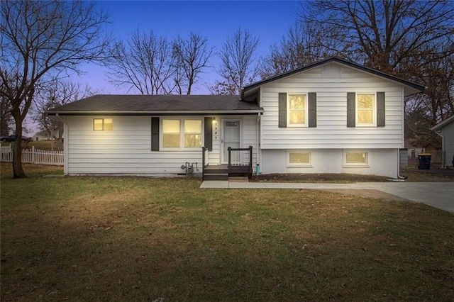 split level home featuring a yard