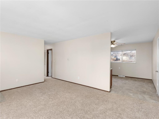 carpeted empty room with ceiling fan