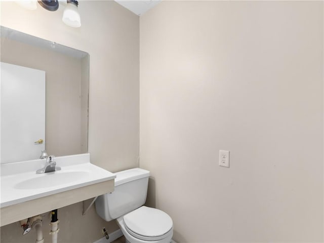 bathroom with toilet and sink