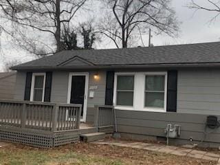 view of front of property with a wooden deck