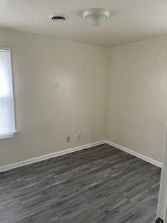 empty room featuring dark hardwood / wood-style floors