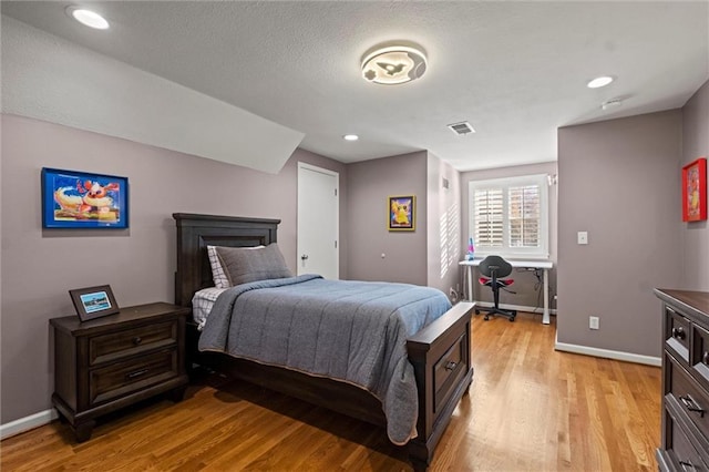 bedroom featuring light hardwood / wood-style flooring