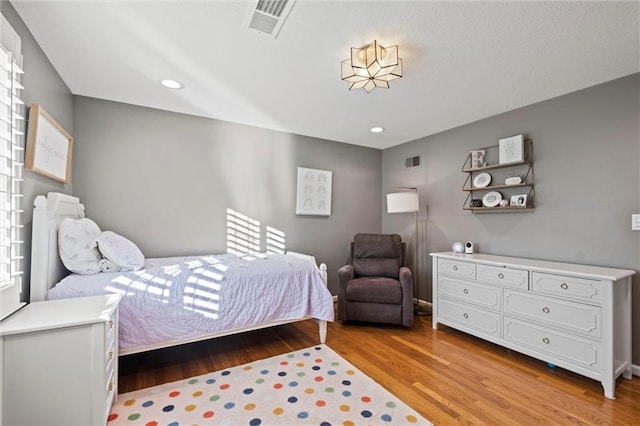 bedroom featuring light hardwood / wood-style flooring