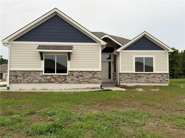 9301 SW Leviathan Ct, Lees Summit, MO 64064 - craftsman-style home featuring stone siding and a front lawn