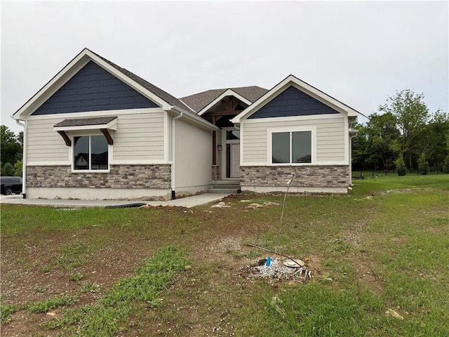 9301 SW Leviathan Ct, Lees Summit, MO 64064 - craftsman inspired home featuring stone siding and a front lawn