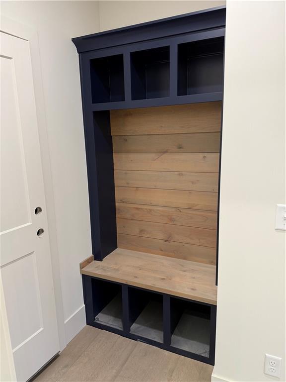 9301 SW Leviathan Ct, Lees Summit, MO 64064 - mudroom featuring a sauna, baseboards, and wood finished floors