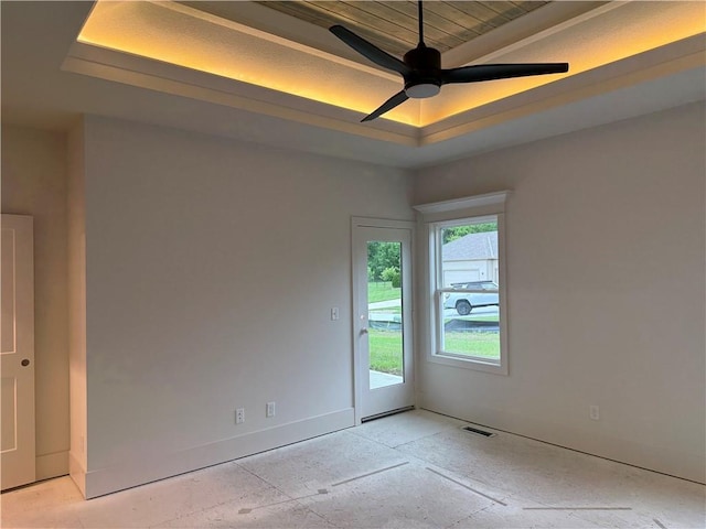 9301 SW Leviathan Ct, Lees Summit, MO 64064 - unfurnished room featuring ceiling fan, baseboards, and a raised ceiling
