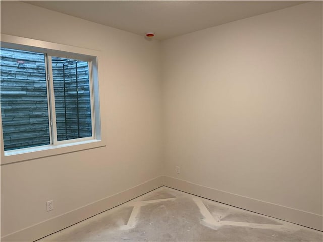 9301 SW Leviathan Ct, Lees Summit, MO 64064 - spare room with baseboards and unfinished concrete floors