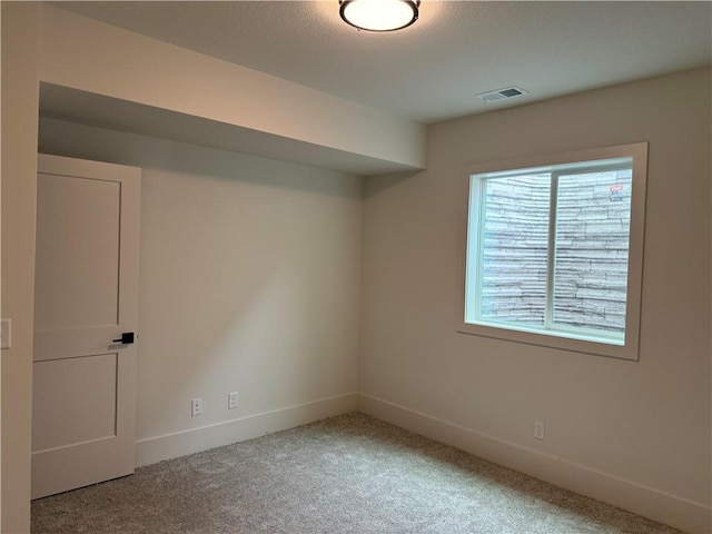 9301 SW Leviathan Ct, Lees Summit, MO 64064 - spare room featuring light colored carpet and baseboards