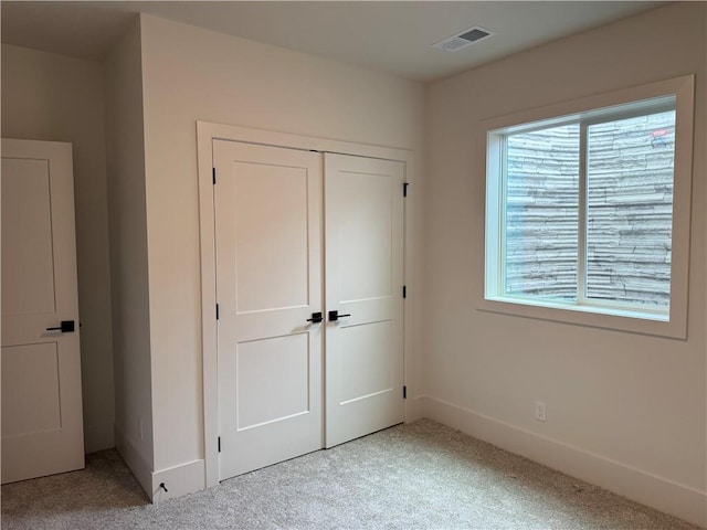 9301 SW Leviathan Ct, Lees Summit, MO 64064 - unfurnished bedroom featuring carpet flooring and a closet