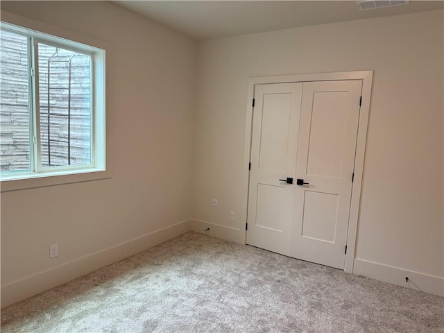 9301 SW Leviathan Ct, Lees Summit, MO 64064 - unfurnished bedroom with carpet flooring and a closet
