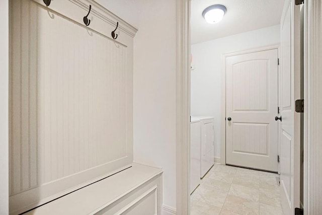 mudroom with independent washer and dryer