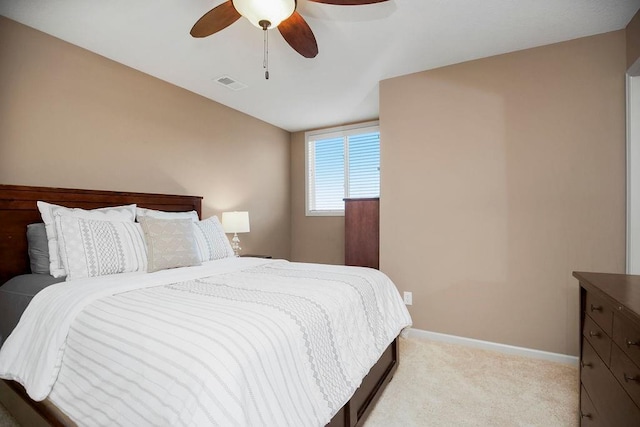 bedroom featuring ceiling fan and light carpet