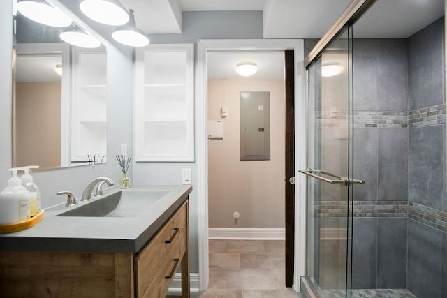 bathroom featuring electric panel, tile patterned flooring, vanity, and an enclosed shower