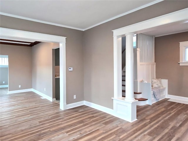 spare room with hardwood / wood-style flooring and ornamental molding