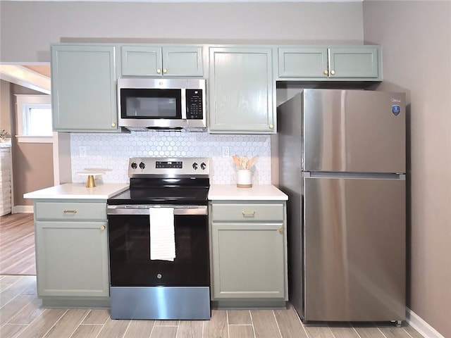 kitchen featuring appliances with stainless steel finishes and backsplash