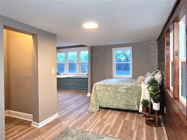 bedroom with hardwood / wood-style floors