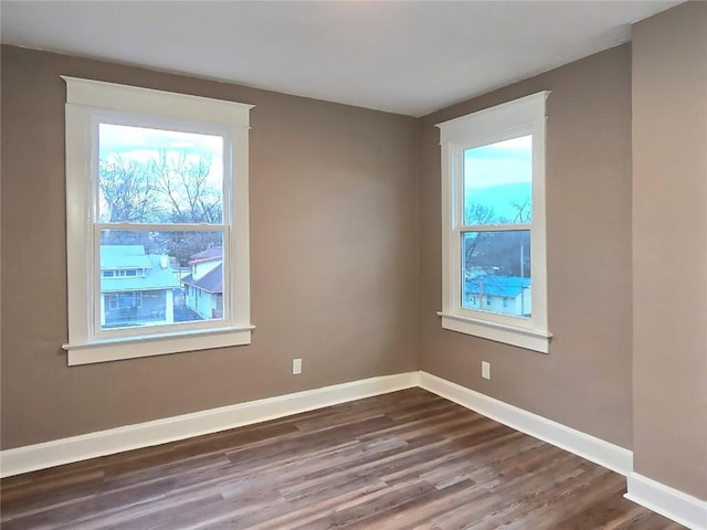 unfurnished room featuring hardwood / wood-style flooring