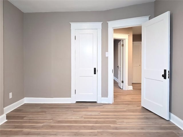 spare room featuring light hardwood / wood-style flooring