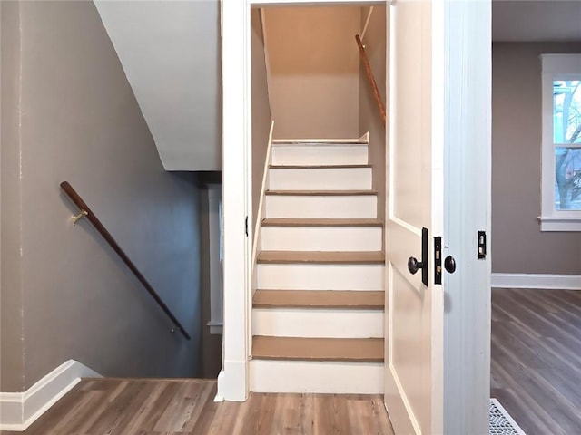 staircase featuring hardwood / wood-style floors