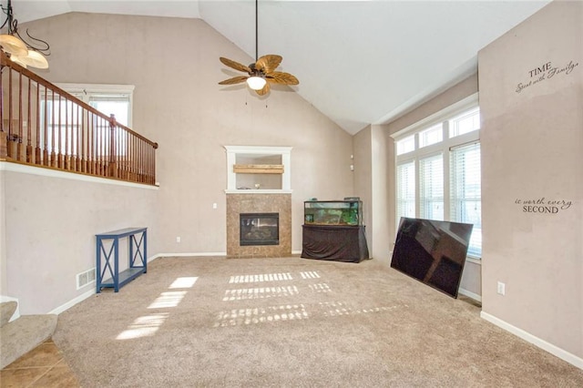 unfurnished living room featuring a fireplace, carpet, ceiling fan, and lofted ceiling