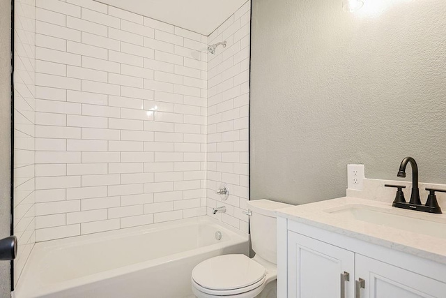 full bathroom featuring vanity, toilet, and tiled shower / bath combo