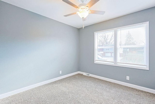 unfurnished room featuring carpet and ceiling fan