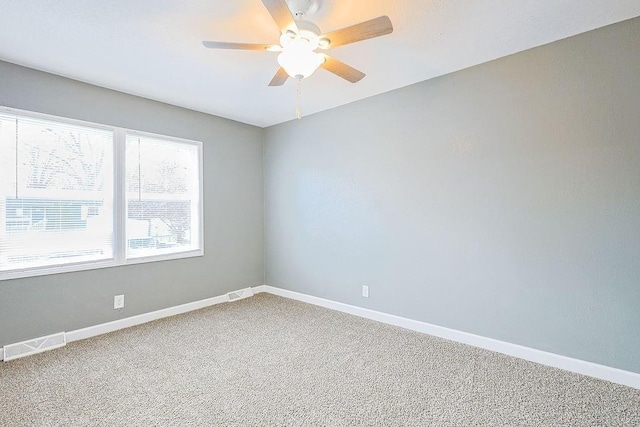 unfurnished room with carpet and ceiling fan