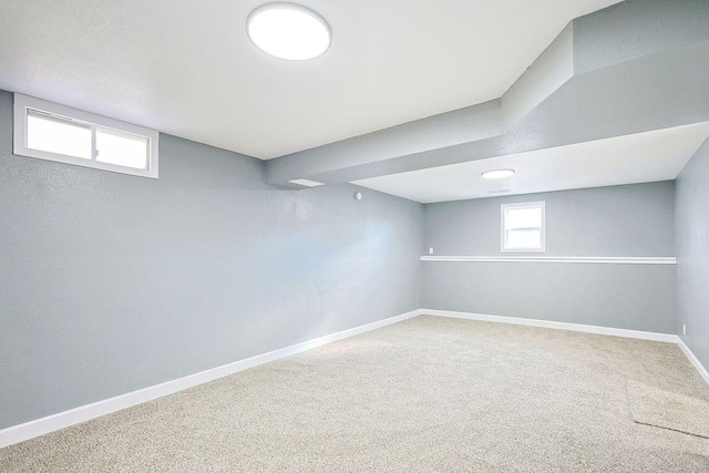 basement featuring carpet and plenty of natural light