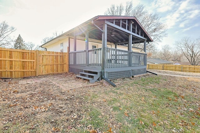 rear view of house featuring a deck