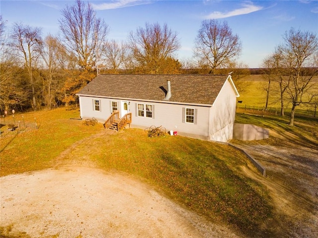 back of house with a yard