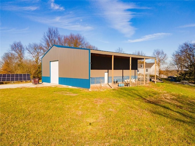 exterior space with a yard and a garage