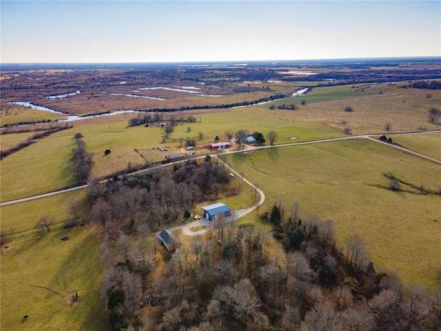 birds eye view of property with a rural view