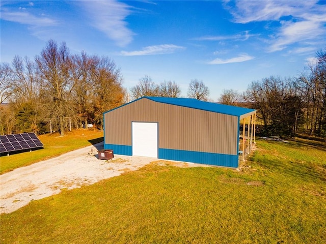 view of outbuilding featuring a yard and a garage