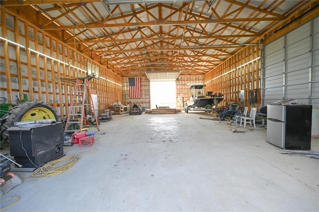 garage with stainless steel fridge