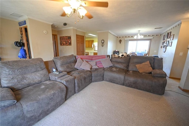 living room with crown molding, carpet floors, and ceiling fan with notable chandelier