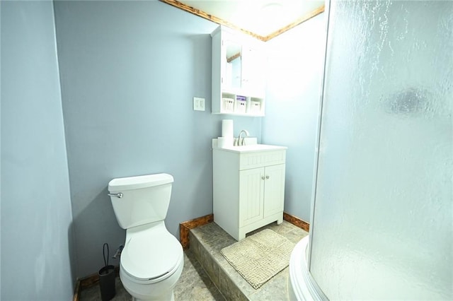 bathroom featuring a shower, vanity, and toilet