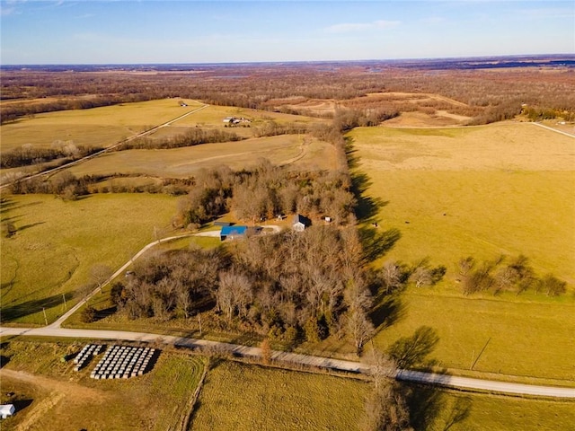 birds eye view of property with a rural view