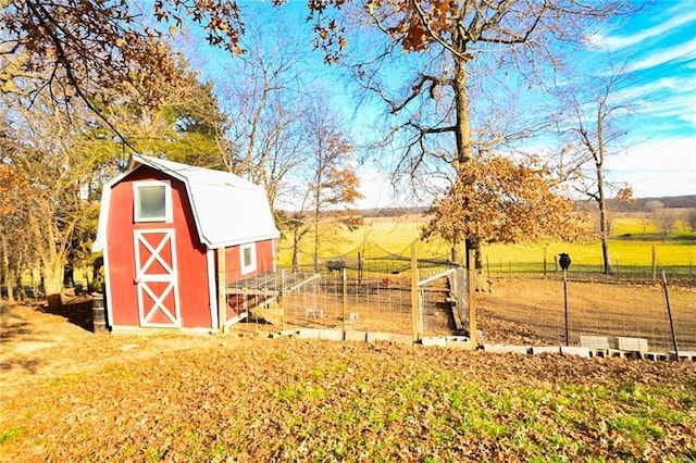 view of outbuilding with a rural view