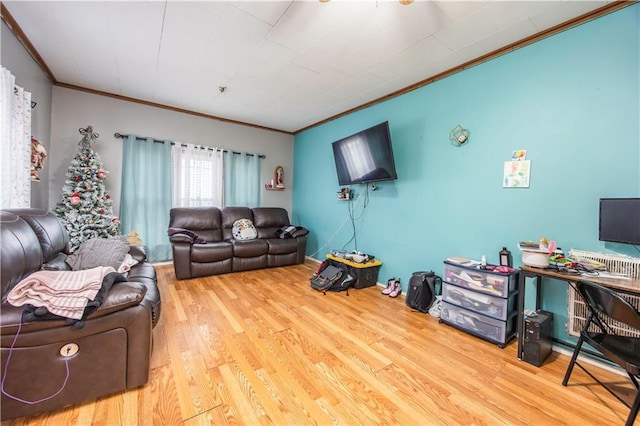 living room featuring hardwood / wood-style floors and ornamental molding