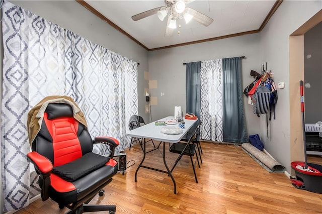 office featuring hardwood / wood-style flooring, ceiling fan, and crown molding