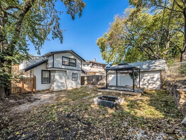 rear view of property with a gazebo