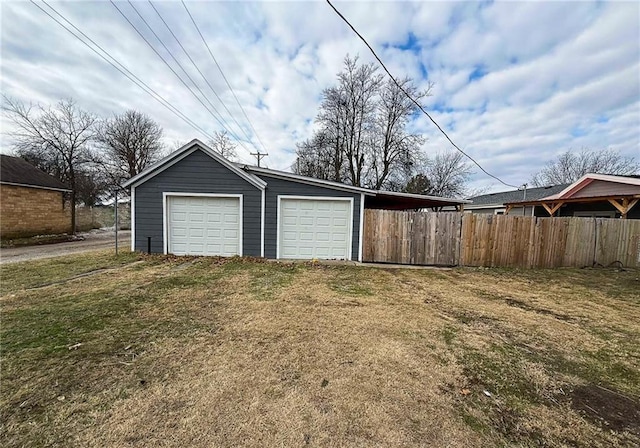 garage featuring a yard